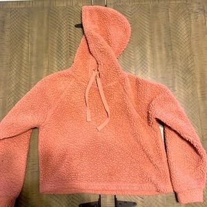 A fluffy pink crop-top